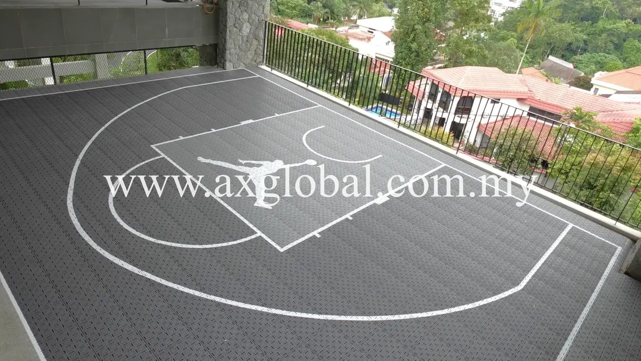 Half basketball court with dark interlocking sports tiles installed in Damansara